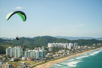 Camboriu, Brazil, December 10, 2017: Students practicing paragliding on the hill, South America