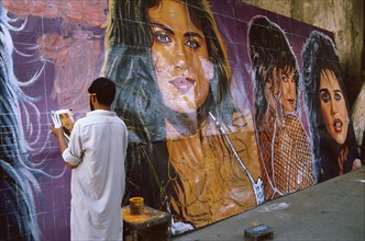 Christian man painting cinema posters, Pakistan, Asia