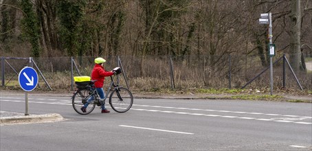 Senior citizens with bicycles in road traffic, Berlin, Germany, Europe