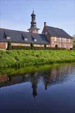 Castle moat with reflection and castle in front of Husum, North Friesland district,