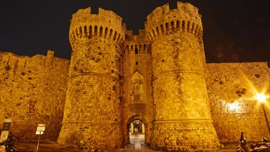 Sea gate, Thalassini Tor, Night view of the massive, illuminated walls of an old fortress, Night