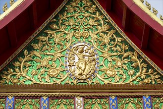 Pediment with earth goddess, Wat Ong Teu, Vientiane, Laos, Asia