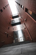 View through a modern brick corridor with windows and passageway, Berlin, Germany, Europe