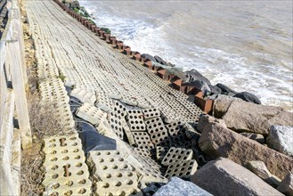 Coastal defences North Sea coast at East Lane, Bawdsey, Suffolk, England, UK showing some damage