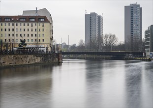Long exposure, the Spree at the Nikolaiviertel quarter and the skyscrapers at Muehlendamm, Berlin,