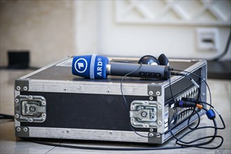 A microphone of the ARD broadcasting network is placed on a split box. Berlin, 26.04.2024
