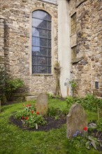 Historic graves and gravestones at St George's Church in the old town of Hattingen, Ennepe-Ruhr