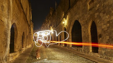 Knights Street, Bright light drawings on a medieval street at night, Night shot, Rhodes Old Town,