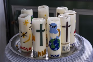 Confirmation candles, decorated candles with the names of the confirmands of 2024 in the Protestant