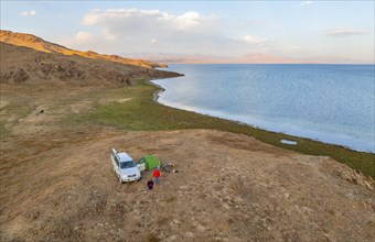 Off-road car camping in the wilderness, Lake Songkoel, Kyrgyzstan, Asia