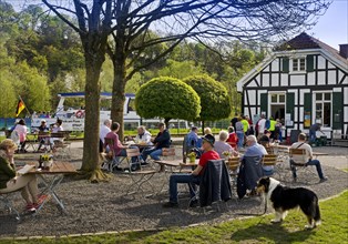 People at the Royal Lockkeeper's House on the Ruhr with the motor vessel MS Schwalbe II, Witten,