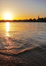 Sunset over the Rhine in Neuss with a view of Volmerswerth in Duesseldorf, Lower Rhine, North