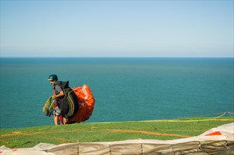 Camboriu, Brazil, December 10, 2017: Students practicing paragliding on the hill, South America