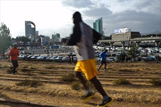 Amateur male athletes, jogging at Meskel square, Addis Ababa, Ethiopia, Africa
