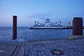 Car ferry Norderaue operated by Wyker Dampfschiffs-Reederei at dusk at the ferry terminal in
