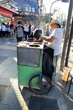 Street vendor preparing roasted peanuts, Buenos Aires, Argentina, South America