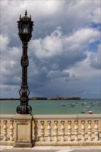 Decorative lantern by the sea, Cadiz, Andalusia, Spain, Europe
