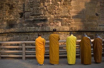 Buddhist monks, prayer, meditation, buddhist pilgrimage site, Sarnath stupa, India, Asia
