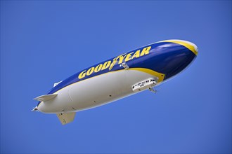 Goodyear, logo, airship, zeppelin, flies over Munich, Bavaria, Germany, Europe