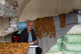 Man selling dried figs, Mardin bazaar, Turkey, Asia
