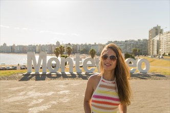 Montevideo, Uruguay, January 11, 2022, Young woman tourist landing at famous site, South America