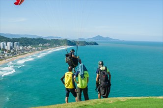 Camboriu, Brazil, December 10, 2017: Students practicing paragliding on the hill, South America