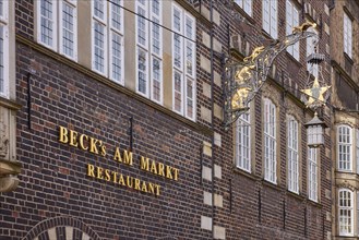 Nose sign and notice on the brick facade of the Becks am Markt restaurant in Bremen, Hanseatic