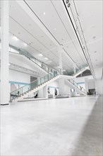 Bright and spacious hall of a modern museum with staircase, Berlinerische Galerie, Berlin, Germany,