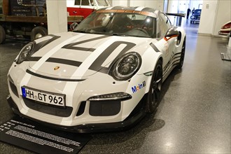 White Porsche 911 GT3 RS with racing stripes in a car show, AUTOMUSEUM PROTOTYP, Hamburg, Hanseatic