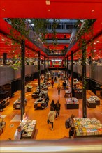 Spacious bookshop with eye-catching red accents and modern lighting, Berlin, Germany, Europe