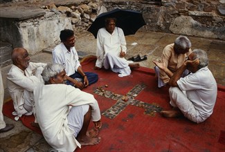 Men playing a board game, pachisi game, Rajasthan, india
