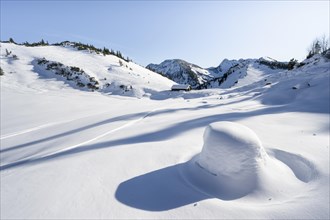 Snow-covered mountain landscape in winter at the Schnittlauchmoosalm, ski tour to the Aiplspitz,