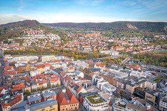 View over the city of Jena with the Kernberge in the background at sunset and blue sky, Jena,