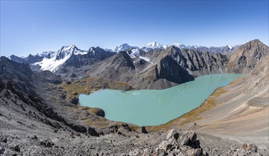 Panorama, view of mountains and glaciers and turquoise Ala Kul mountain lake, ascent to the Ala Kul