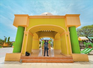 Young tourist in the central park of Nagarote, Nicaragua. Portrait of tourist at the colorful