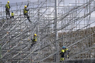 Construction workers on scaffolding, preparations for the Olympic Games in Paris 2024, Paris,