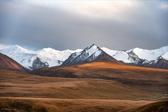 Glaciated and snow-covered mountains, dramatic mountain landscape in the evening light, autumnal