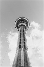 View from below of Auckland's landmark, the Sky Tower. Black and white sunset shot in New Zealand