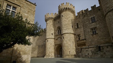 Medieval castle with striking towers under a clear sky, forecourt, Grand Master's Palace, Knights'