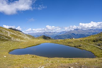 Small mountain lake with mountain panorama, Carnic Main Ridge, Carnic High Trail, Carnic Alps,