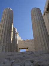 View of several ancient columns and ruins under a blue sky, historical columns and ruins at an