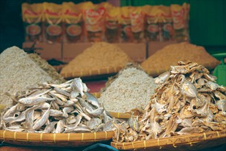 Heaps of Bulad or traditional Filipino salted dried fish displayed for sale in a local market stall