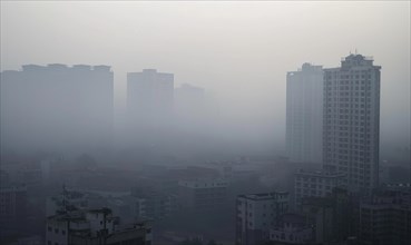 Urban landscape shrouded in smog with tall buildings barely visible AI generated