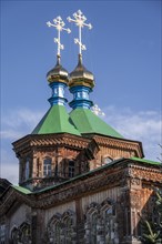 Russian Orthodox Church Cathedral of the Holy Trinity, wooden church with green spires, Karakol,