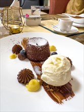 Elegant Design of a Beauty Chocolate Souffle Cake with Vanilla Ice Cream on Plate in Switzerland