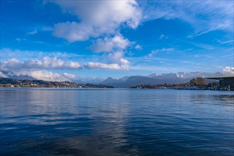 Lake Lucerne with mountain landscape in the background and blue sky with clouds, Lucerne,
