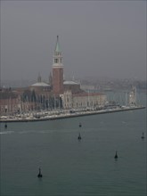 San Giorgio Maggiore church in Venice with a view of the lagoon in a misty evening mood, church