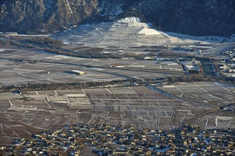 The municipality of Riddes in the Rhone Valley surrounded by vineyards in winter, Riddes, Valais,