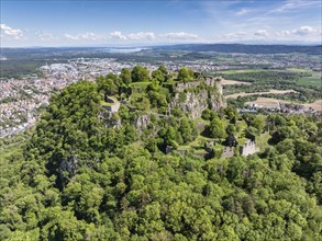 Aerial view of the Hohentwiel volcanic cone with Germany's largest fortress ruins, behind it the