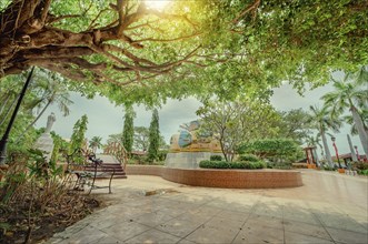 Traditional park of Nagarote, Nicaragua. A relaxed park with a wooden bridge over a water fountain,